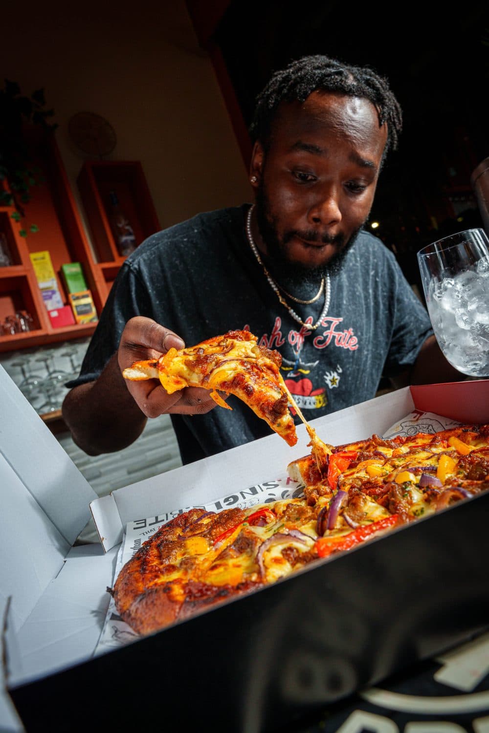 Tucking into a fresh Pzaza slice
